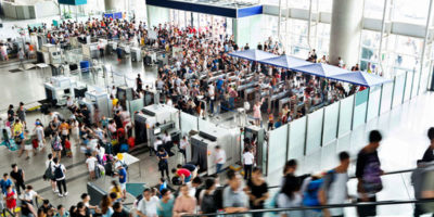 People walking in busy airport.