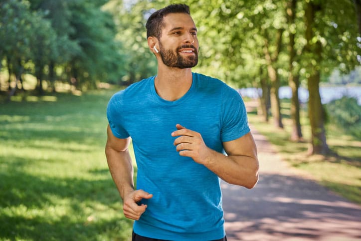 Man jogging with blue shirt