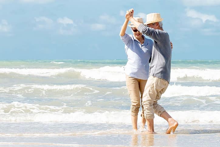 Older Couple Loving Life on the Beach after Regenerative Medicine Treatments