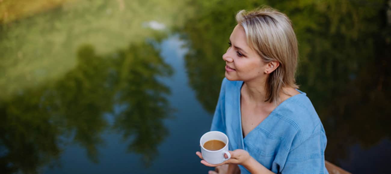 woman with Tea After PRP Treatment for Hair Restoration near Lake Orion MI