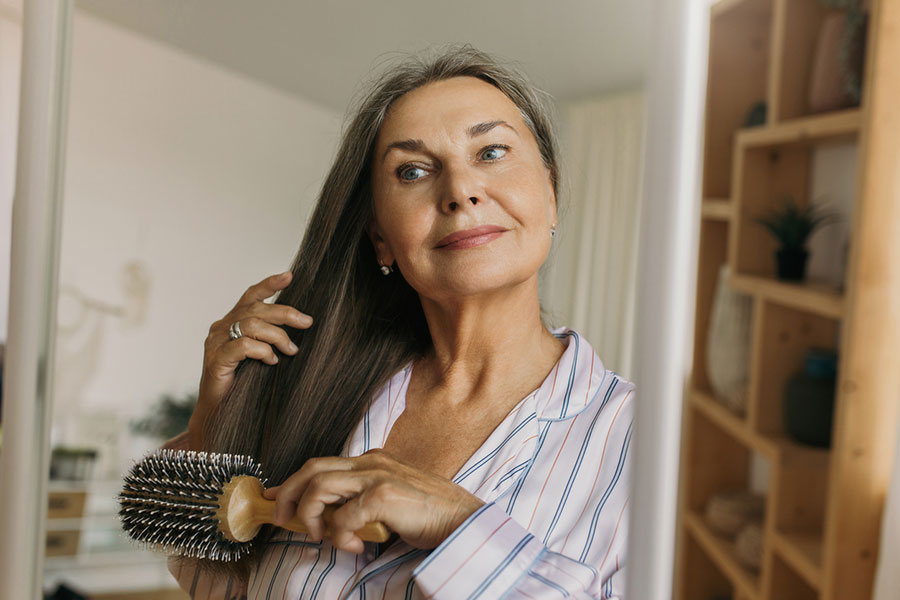 Woman brushing hair