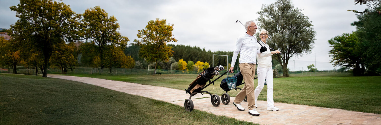 Older couple golfing