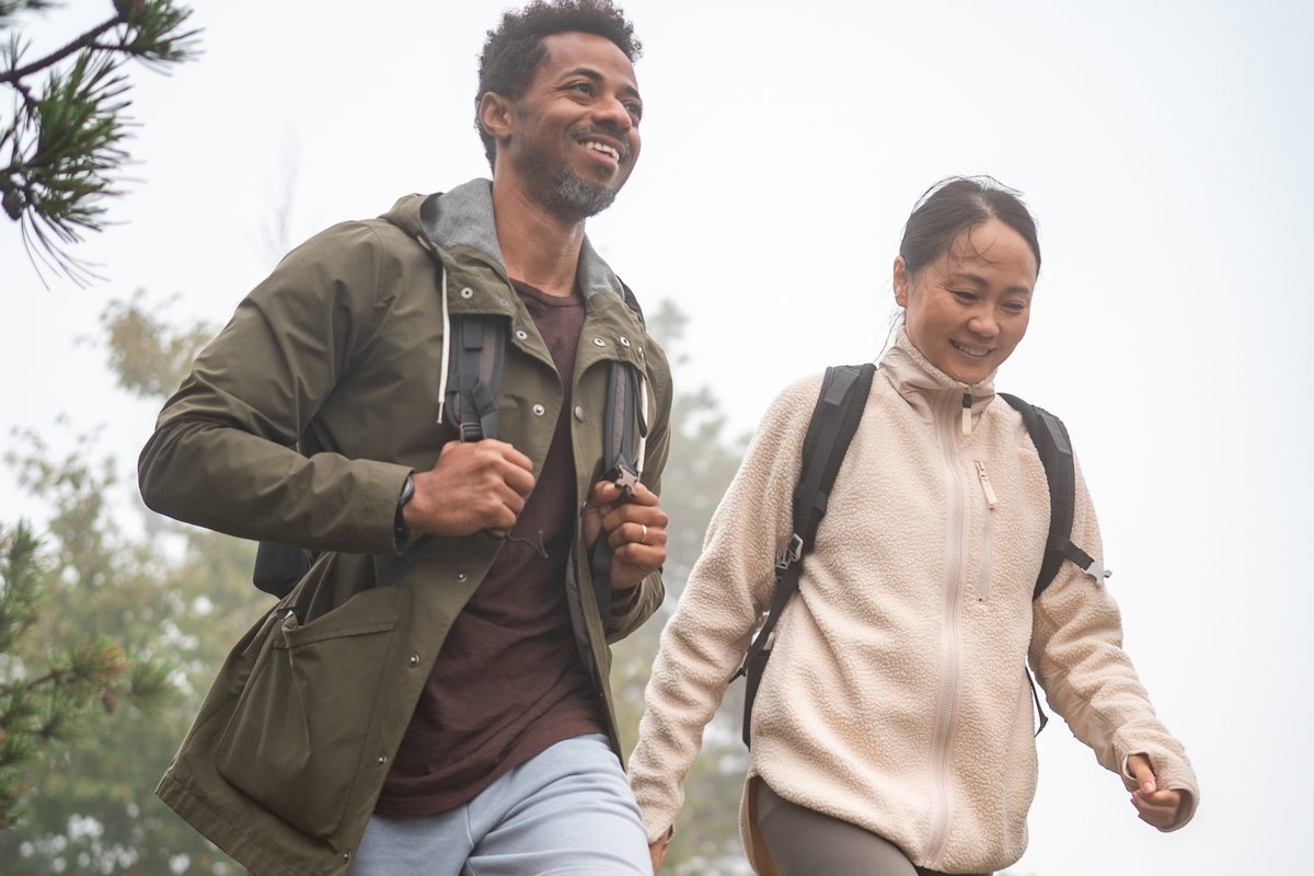 Couple hiking a rocky hillside