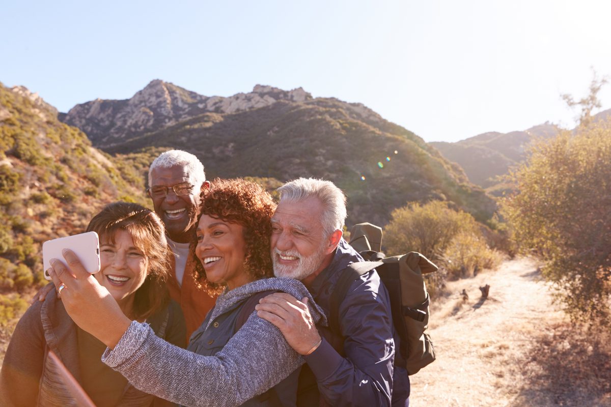 Friends taking a selfie on a mountain hike