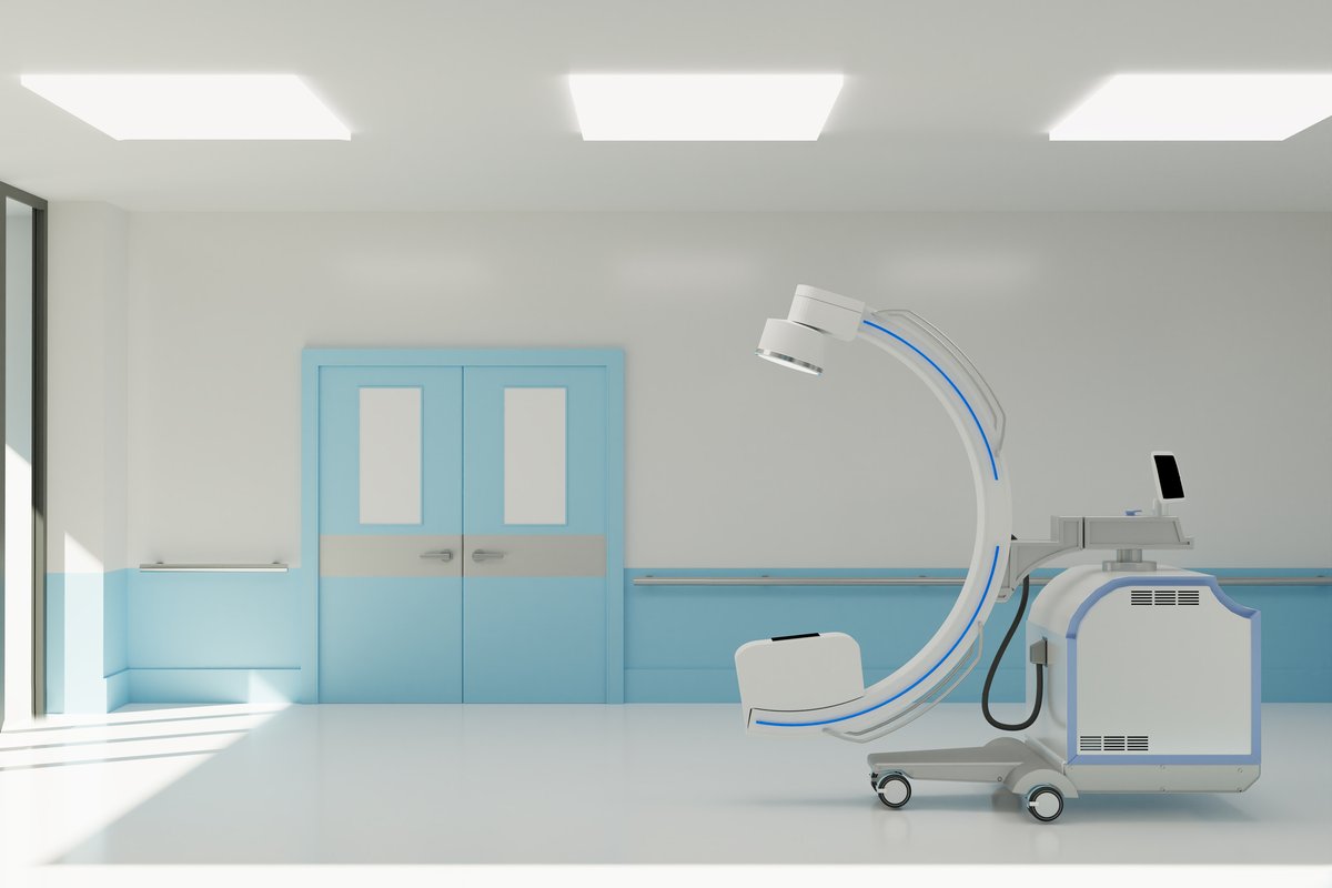 Modern procedure room with C-arm imaging