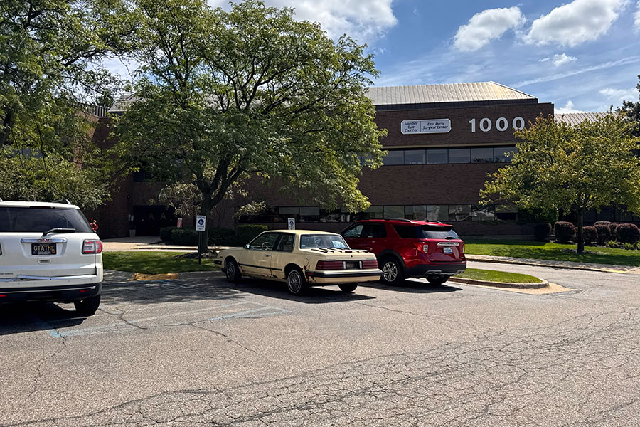 A brick office building labeled 1000 and Vencor Eye Center/East Paris Surgical Center with a parking lot in front, serving as a Grand Rapids business location.