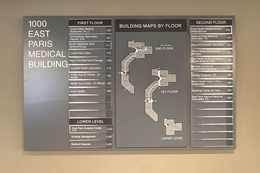 Building directory for the 1000 East Paris medical office workspace in Grand Rapids, showing floor maps and a list of practices by floor and suite number.