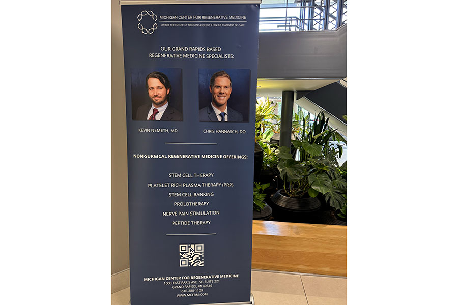 Informational banner for the Michigan Center for Regenerative Medicine in our Grand Rapids office, featuring Dr. Kevin Nemeth and Dr. Chris Hannasch, a list of services, contact information, and a QR code.