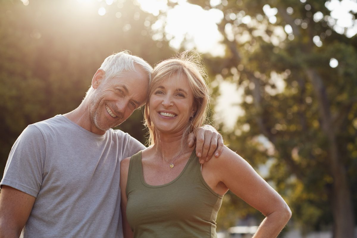 Smiling couple enjoying time outdoors at sunset