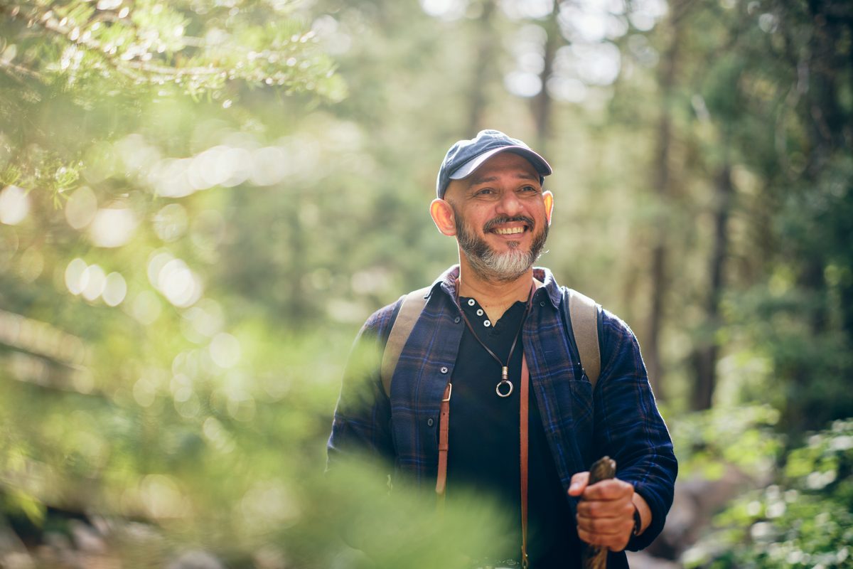 Smiling hiker in the woods