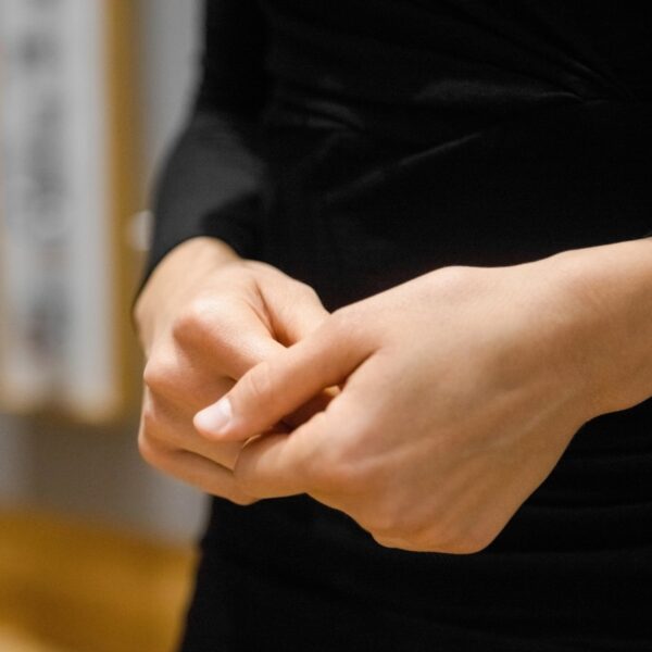 Close-up of a woman rubbing her hands