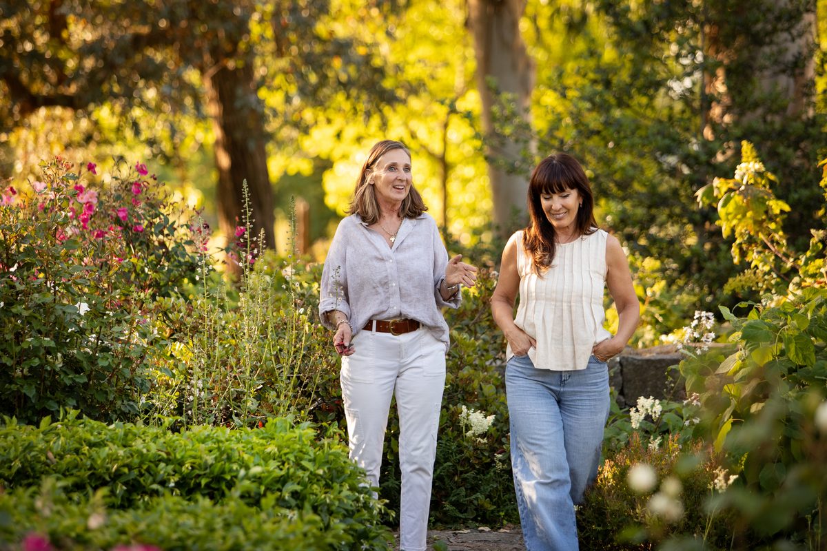 Women walking through a garden
